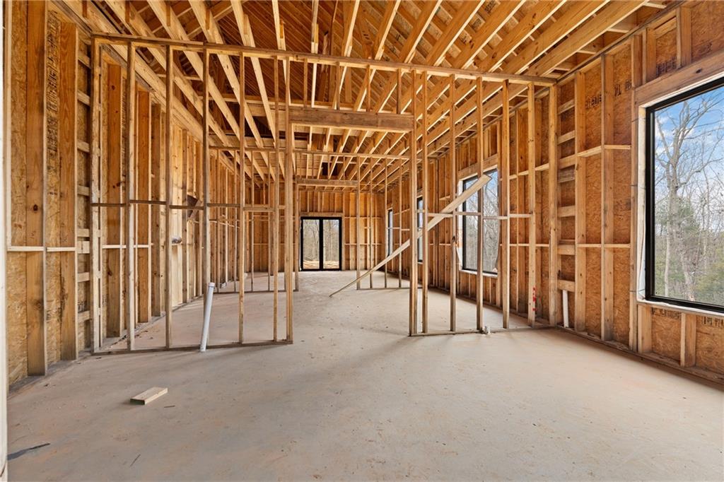 385 River Bend Road Dawsonville, GA 30534 - Photo 7 of 42 an empty room with windows