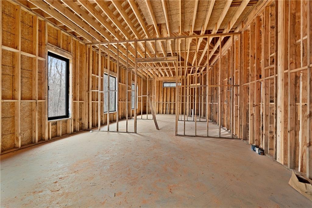385 River Bend Road Dawsonville, GA 30534 - Photo 9 of 42 a view of an empty room with wooden walls
