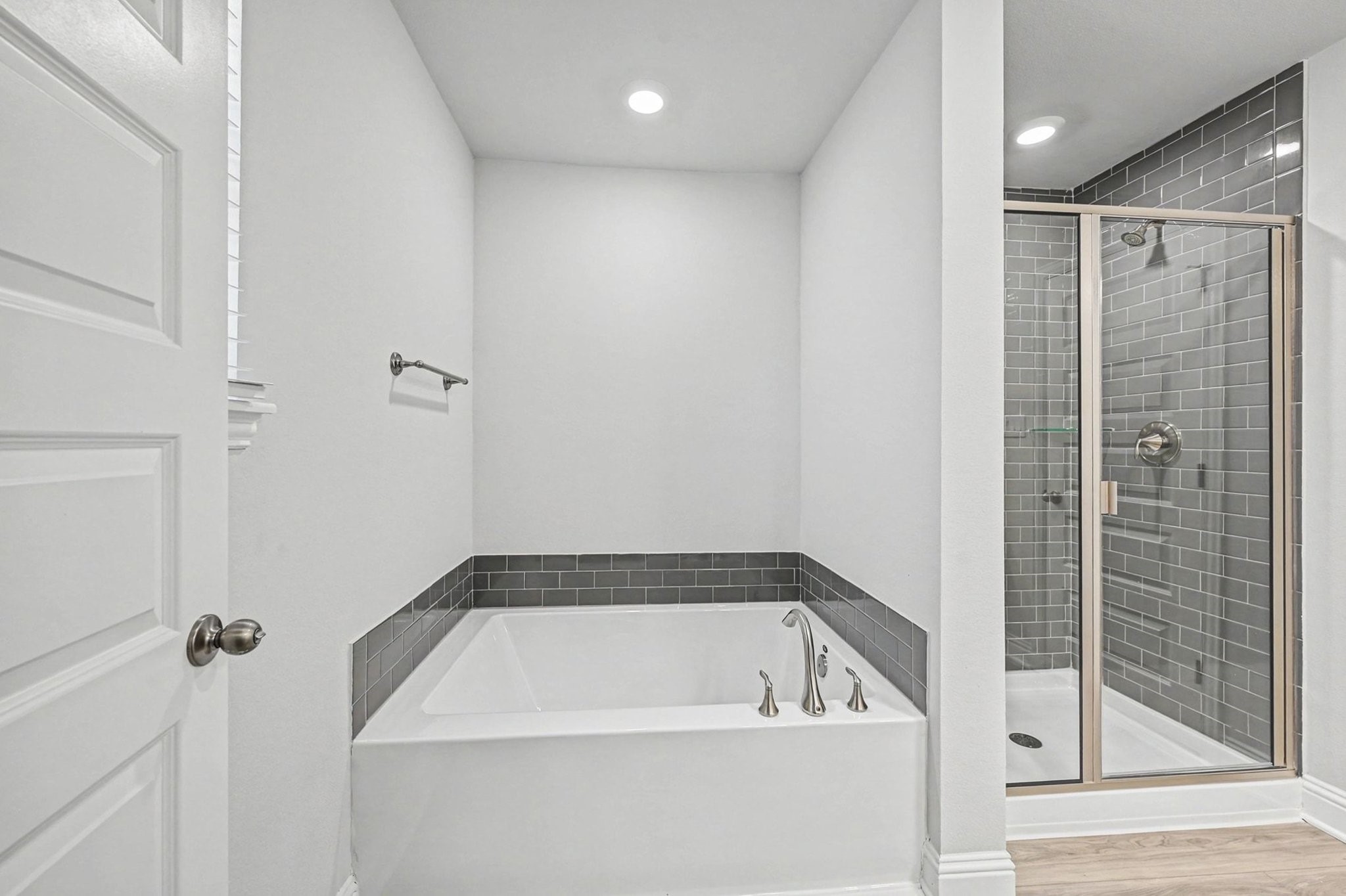 601 Greystone Lane Angleton, TX 77515 - Photo 23 of 32 a bathroom with a bathtub and a shower