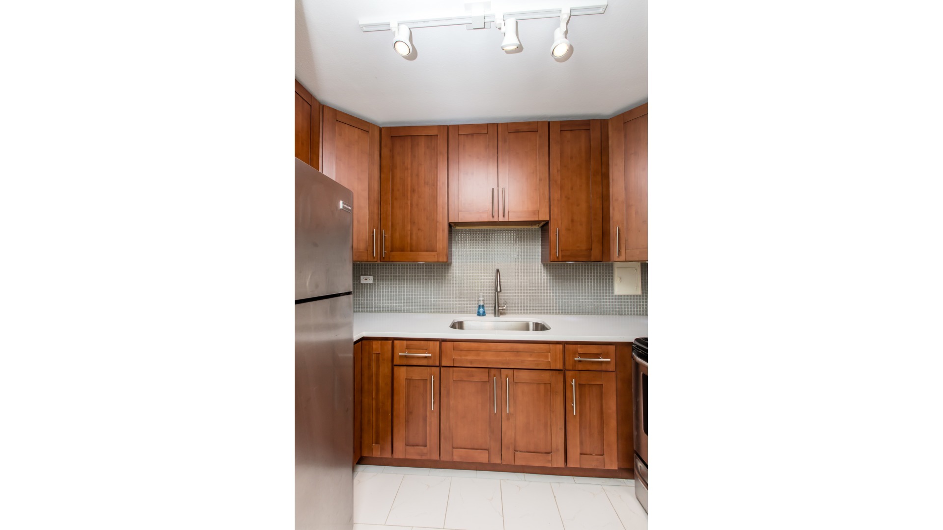 Undisclosed Address Chicago, IL 60611 - Photo 11 of 18 a bathroom with a sink and a mirror