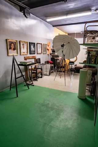 a living room with dining table and wooden floor