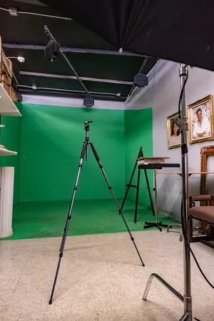 a living room with furniture and floor to ceiling windows