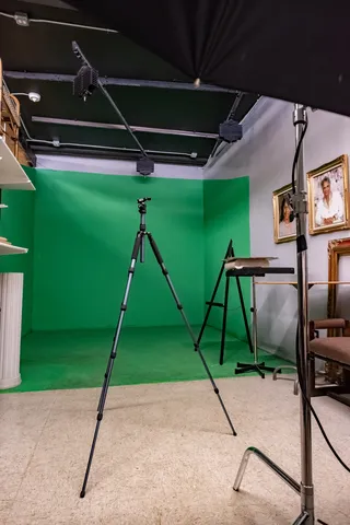 a living room with furniture and floor to ceiling windows