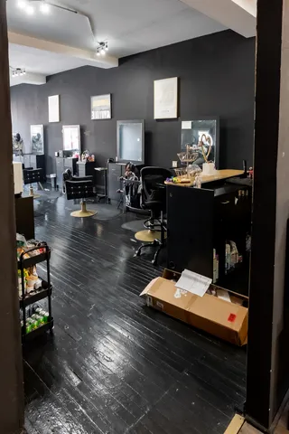 a living room filled with furniture and a flat screen tv