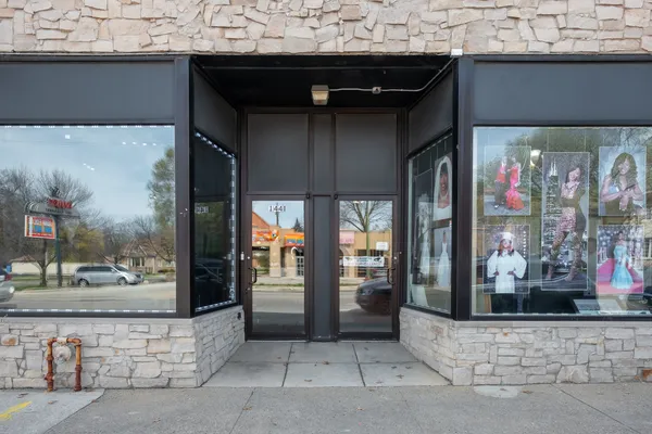 a view of a building with a door and a window