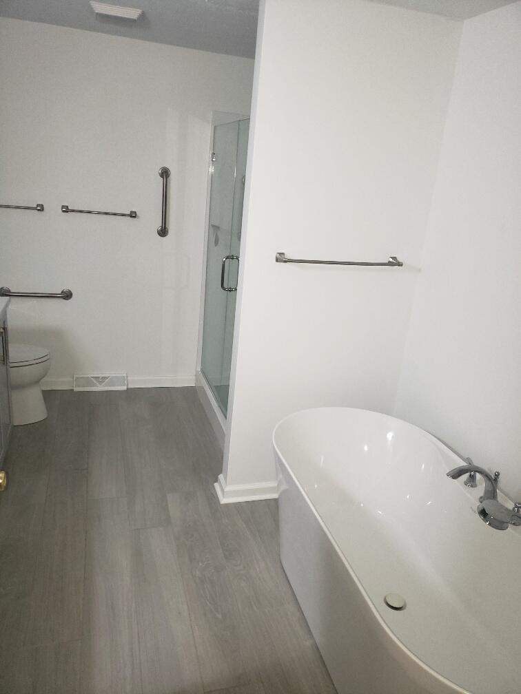 2086 Founding Way Road Bedford, VA 24523 - Photo 22 of 32 a bathroom with a tub and toilet