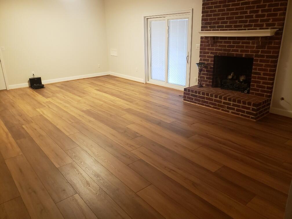 2086 Founding Way Road Bedford, VA 24523 - Photo 27 of 32 a view of an empty room with wooden floor a fireplace and a window