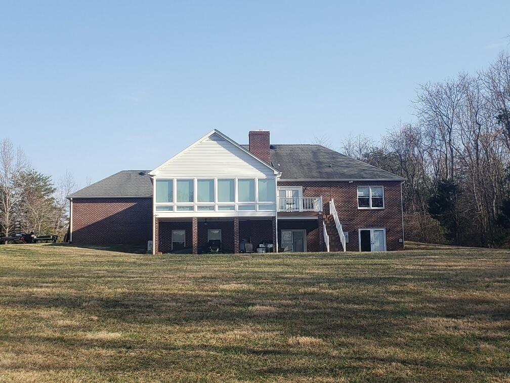 2086 Founding Way Road Bedford, VA 24523 - Photo 3 of 32 a front view of a house with a yard