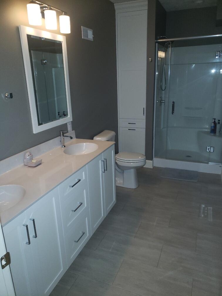 2086 Founding Way Road Bedford, VA 24523 - Photo 32 of 32 a spacious bathroom with a double vanity sink toilet mirror and shower