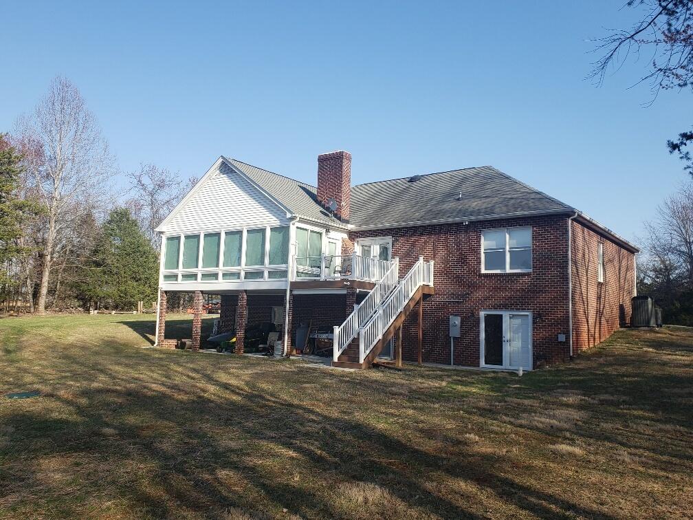 2086 Founding Way Road Bedford, VA 24523 - Photo 4 of 32 a front view of a house with a yard