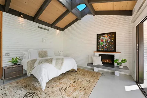 a spacious bathroom with a bathtub and shower