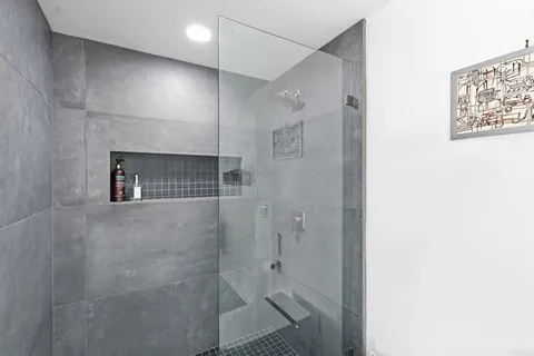 a living room with furniture and large window with outer view