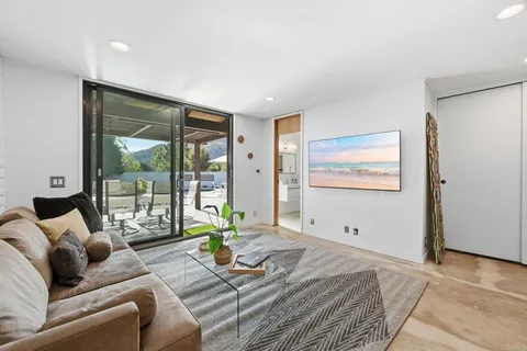 a patio with a patio table and chairs