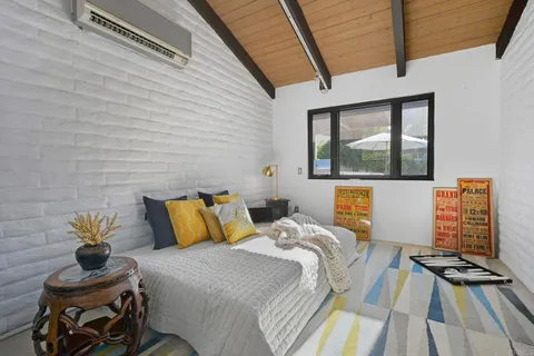 a view of a backyard with sitting area