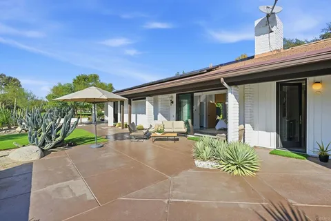 an aerial view of a house with a garden