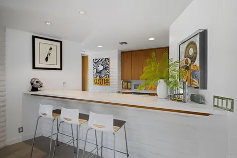 a kitchen with a stove cabinets and window