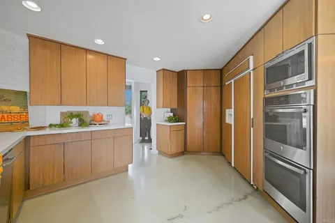 a kitchen with a sink and a refrigerator