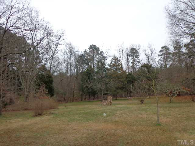3632 Cheek Road Durham, NC 27704 - Photo 3 of 3 a view of a field with trees in background