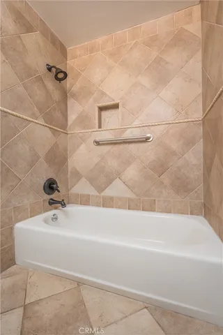 a bathroom with a toilet a sink and bathtub