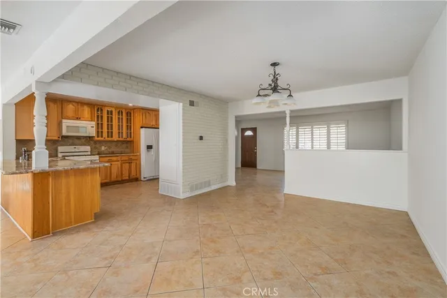 a view of livingroom with hardwood floor and kitchen view