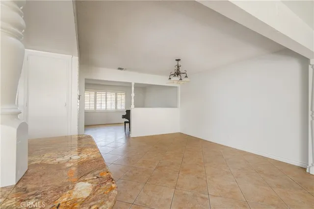 a kitchen with stainless steel appliances granite countertop a stove and a refrigerator
