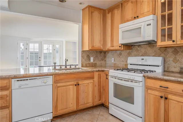 an empty room with a fireplace and windows