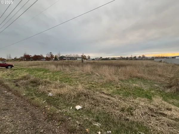 a view of a lake with houses in the back