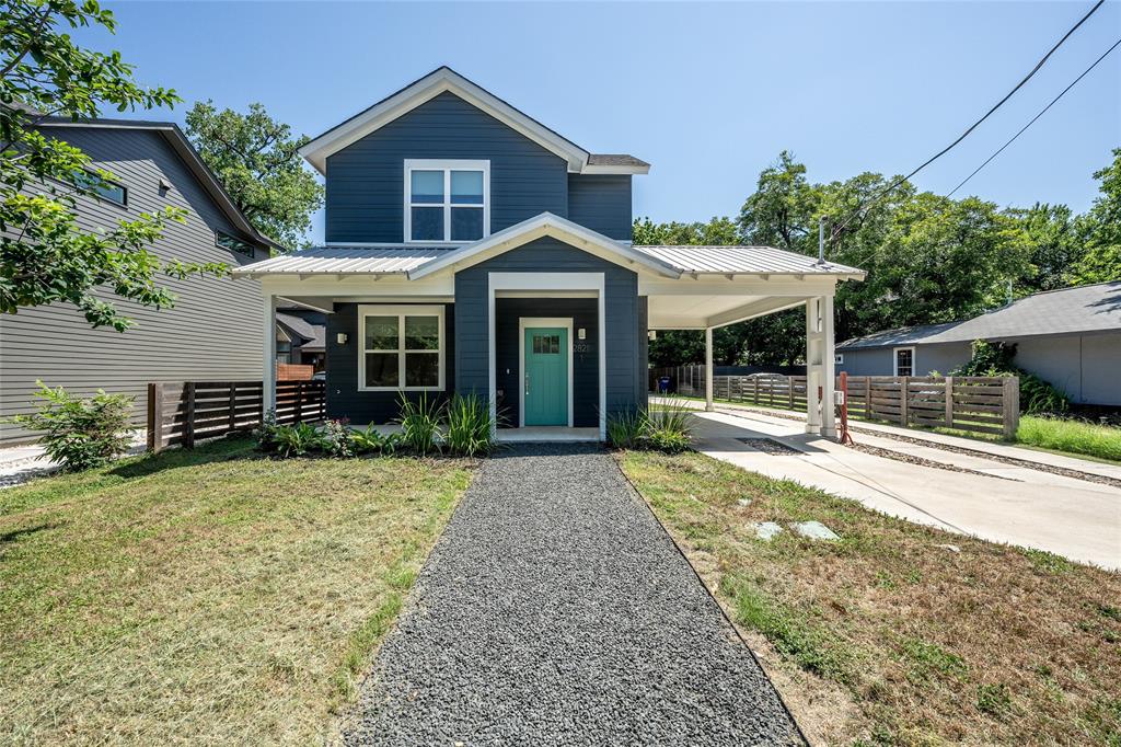 Modern two-story residence with dark blue horizontal siding and white trim