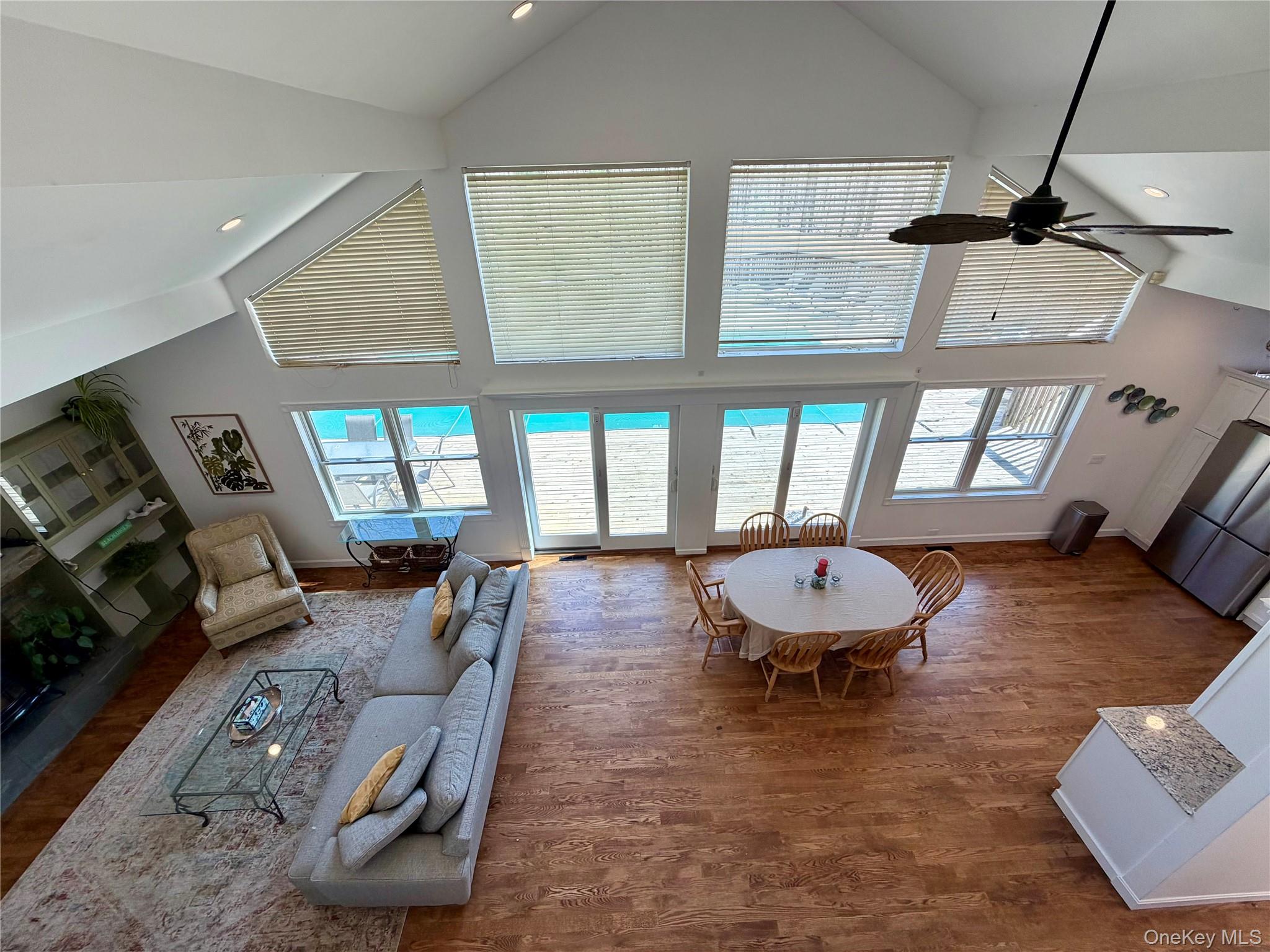 43 B Old Squires Road Hampton Bays, NY 11946 - Photo 8 of 12 a living room with furniture and a large window