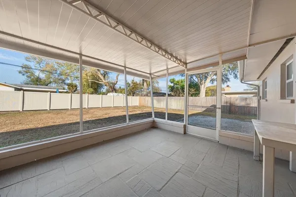 a view of an empty room with sliding glass door