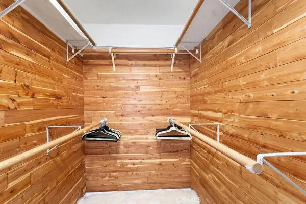 a view of a workspace with furniture and wooden floor