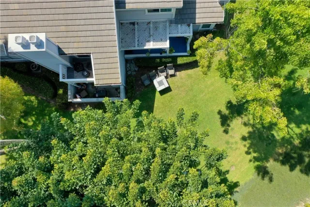 a aerial view of a house with swimming pool and garden