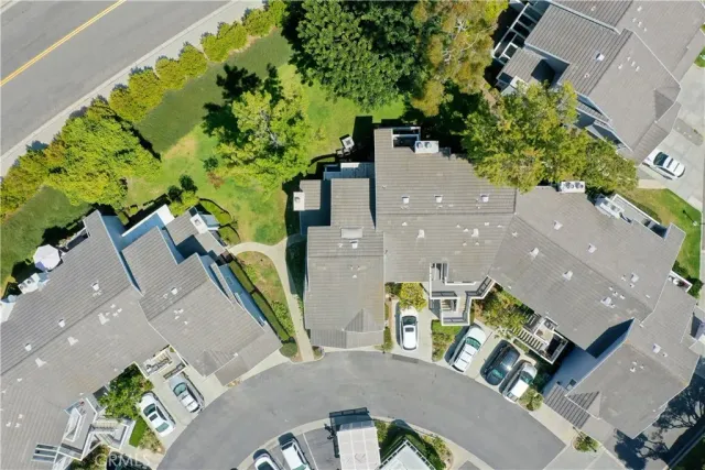 an aerial view of multiple houses with yard