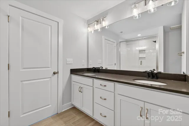 a bathroom with a shower and toilet