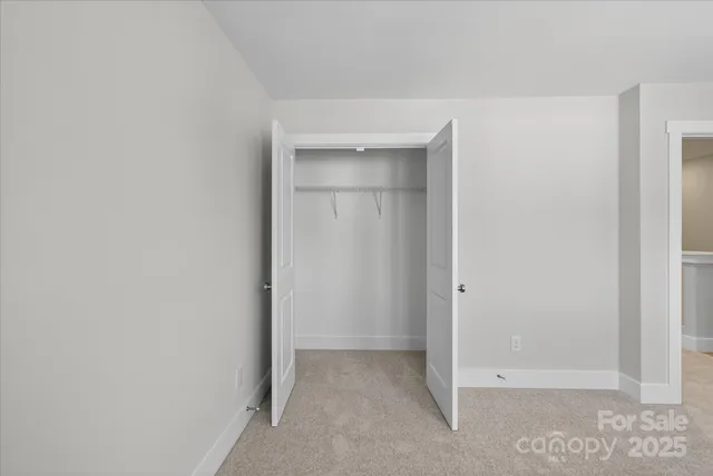 a bathroom with a sink toilet vanity and shower