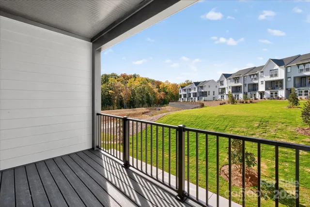 a view of a balcony with wooden floor