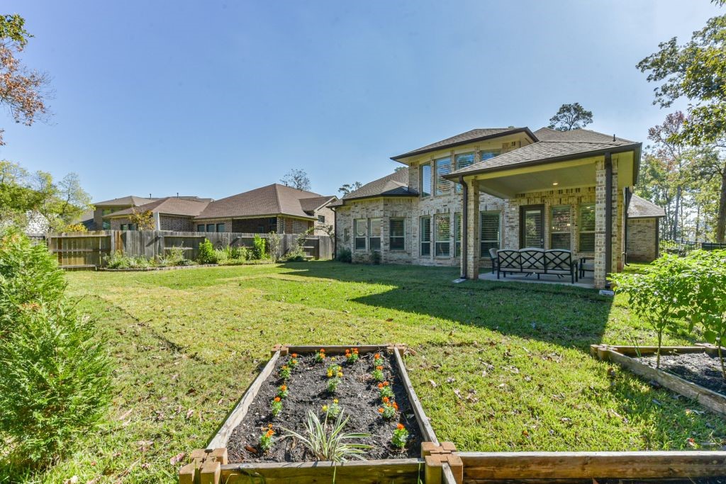 126 Keechie Creek Court Conroe, TX 77304 - Photo 12 of 50 front view of a house with a yard