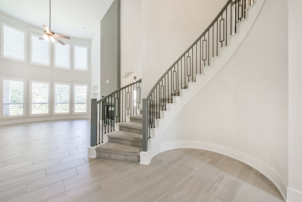 126 Keechie Creek Court Conroe, TX 77304 - Photo 16 of 50 a view of staircase with white walls and windows