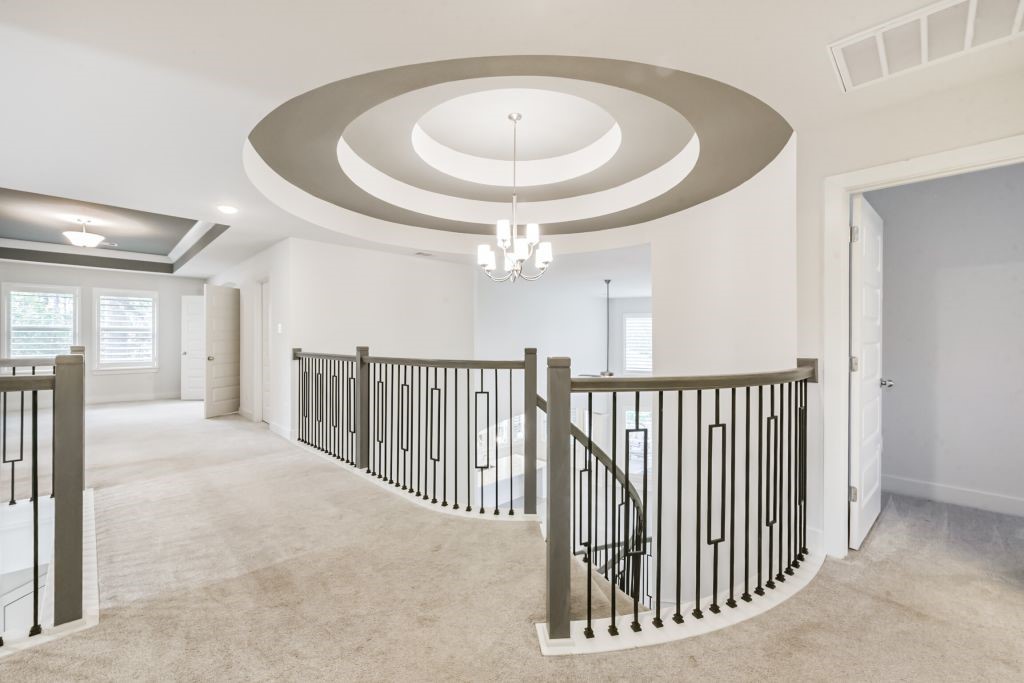 126 Keechie Creek Court Conroe, TX 77304 - Photo 41 of 50 a view of a hallway with a chandelier and entryway