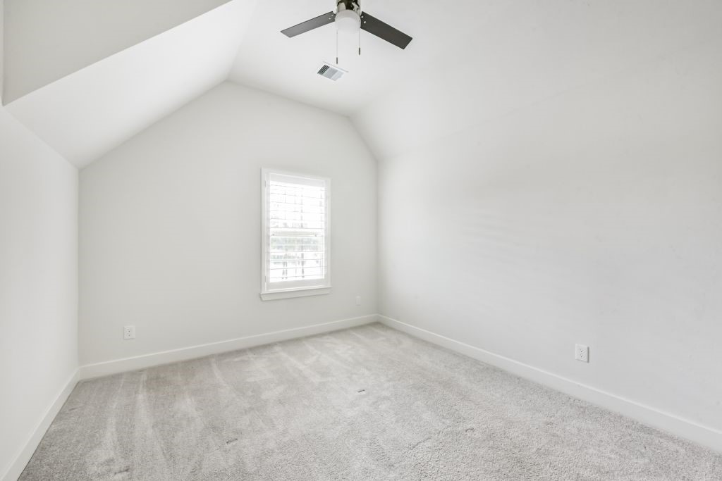 126 Keechie Creek Court Conroe, TX 77304 - Photo 45 of 50 an empty room with a window