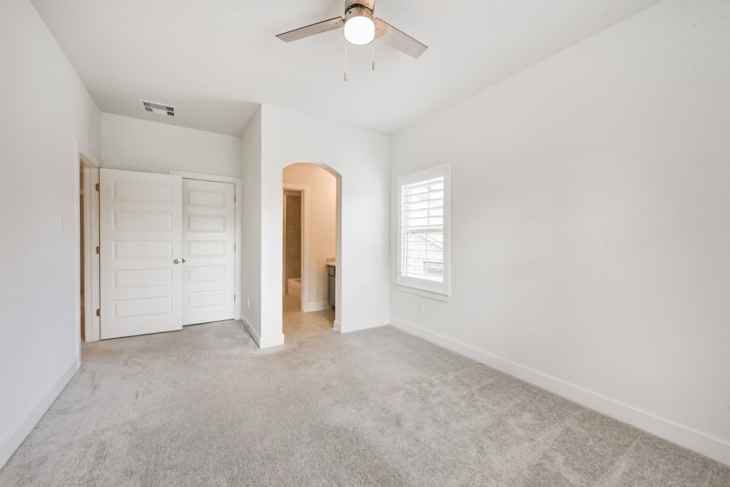 126 Keechie Creek Court Conroe, TX 77304 - Photo 49 of 50 wooden floor in an empty room with a window