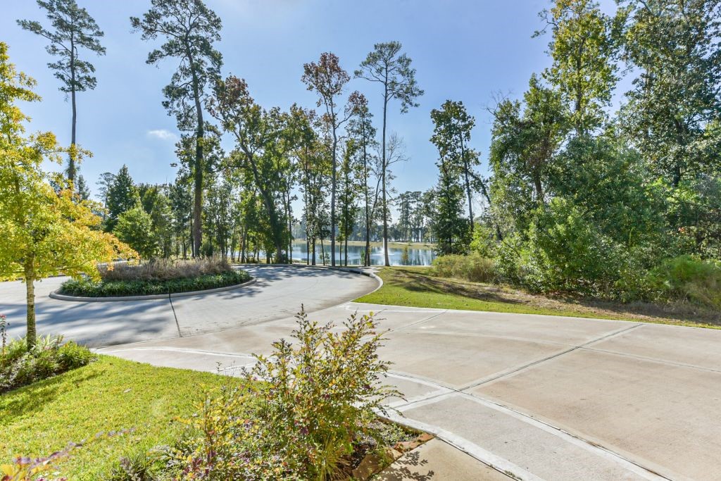 126 Keechie Creek Court Conroe, TX 77304 - Photo 7 of 50 a view of a yard with plants and trees