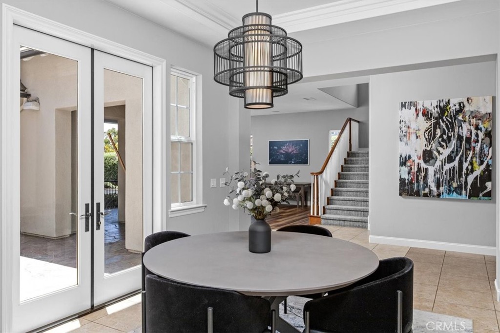 2453 Lapis Road Carlsbad, CA 92009 - Photo 8 of 74 Beautiful french doors that open into the courtyard to enjoy a nice glass of wine by the fireplace.