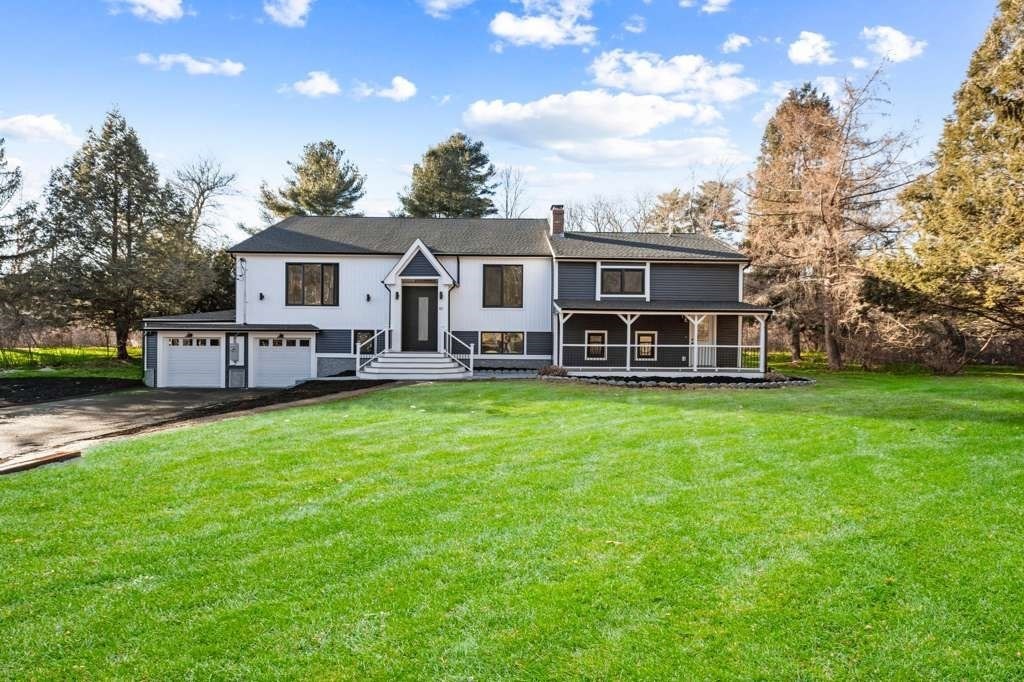 a view of a house with a backyard