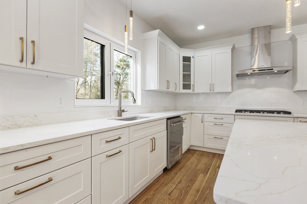 85 Jewell Street Mansfield, MA 02048 - Photo 12 of 42 a kitchen with a sink window and cabinets