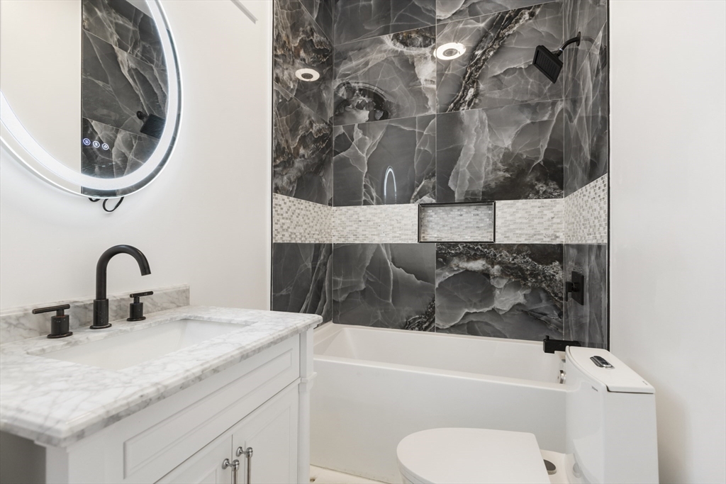 85 Jewell Street Mansfield, MA 02048 - Photo 29 of 42 a bathroom with a sink and a mirror