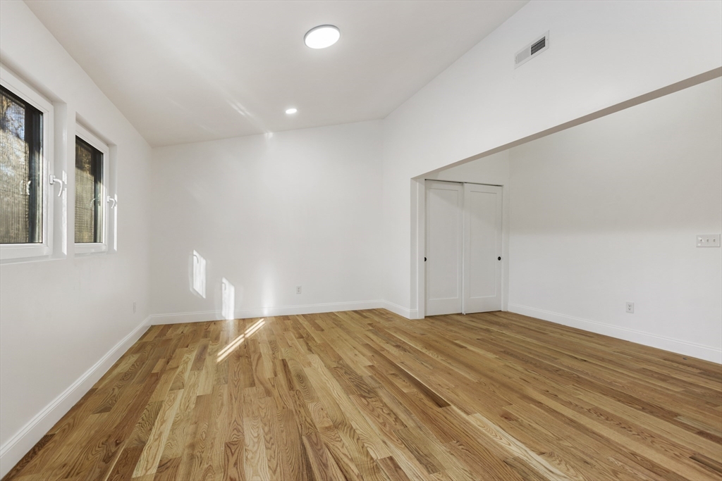 85 Jewell Street Mansfield, MA 02048 - Photo 32 of 42 a view of empty room with wooden floor and fan