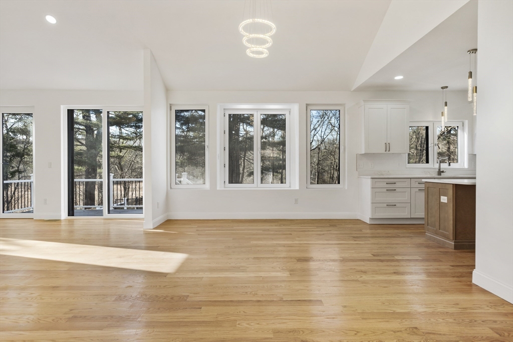 85 Jewell Street Mansfield, MA 02048 - Photo 8 of 42 a view of an empty room with a window and wooden floor