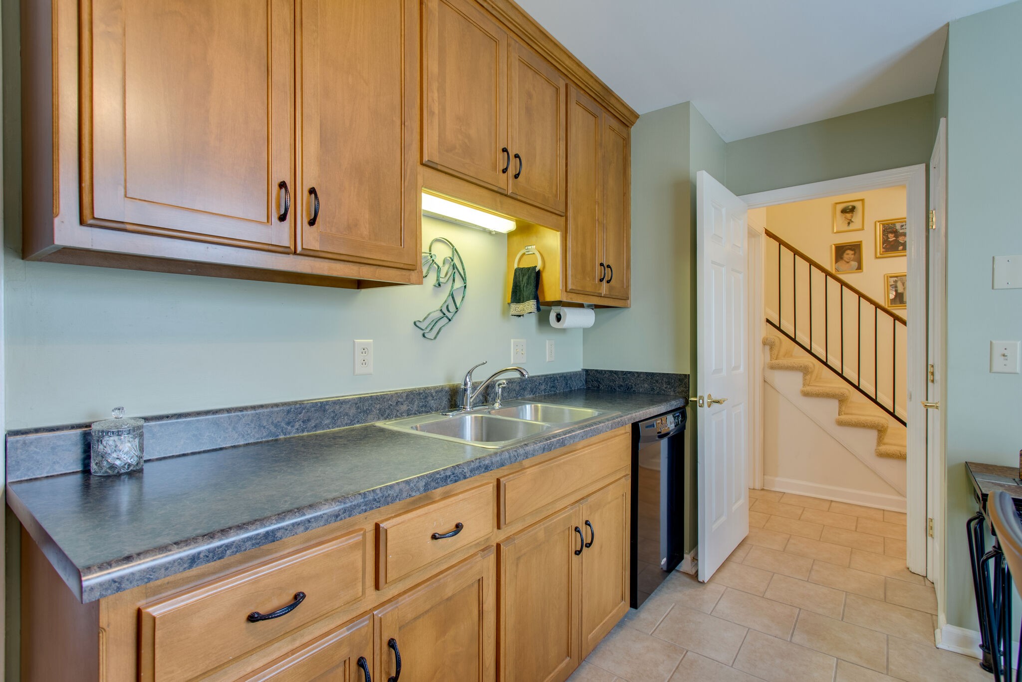 1006 General George Patton Road Nashville, TN 37221 - Photo 4 of 29 a kitchen with granite countertop a sink and cabinets