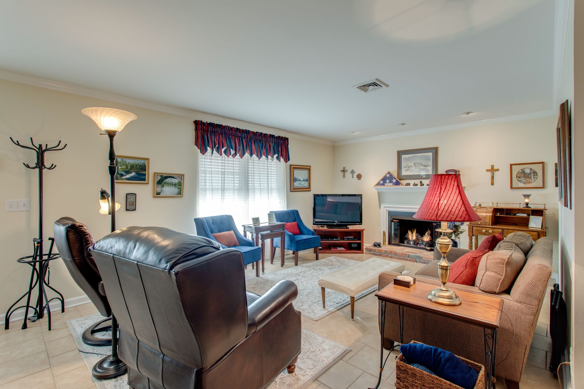 1006 General George Patton Road Nashville, TN 37221 - Photo 9 of 29 a living room with furniture a fireplace and a flat screen tv